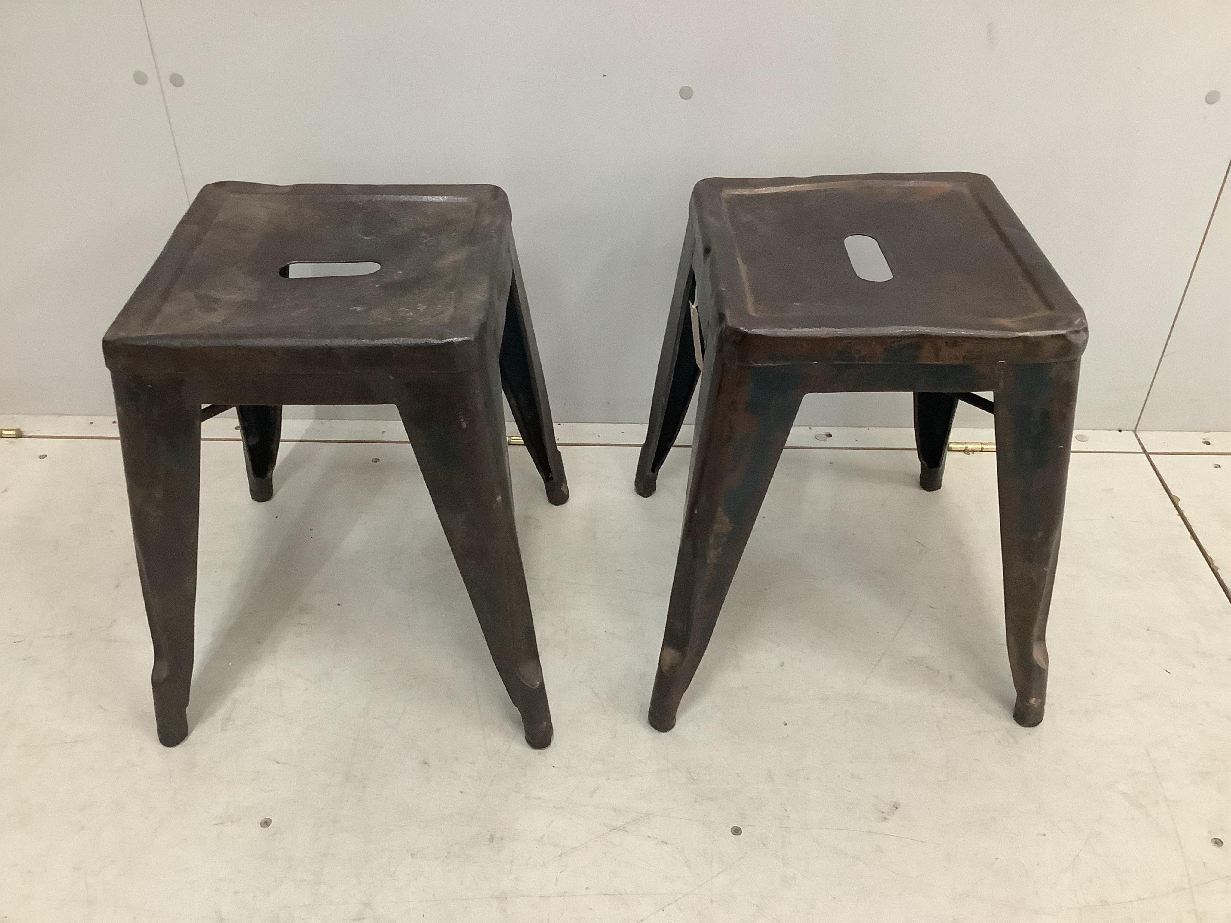 A pair of Tolix vintage industrial style metal stools, width 39cm, height 44cm